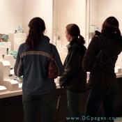 Visitors view the many dazzling gemstones displayed in the museum.