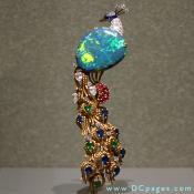 Opal with diamond and corundum. This pin appears alive and sparkling in all the colours of the rainbow. 