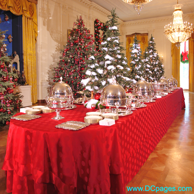 The State Dining Room tablecloths are red-on-red polka dots with a little forest of trees that run down the center of the tables
