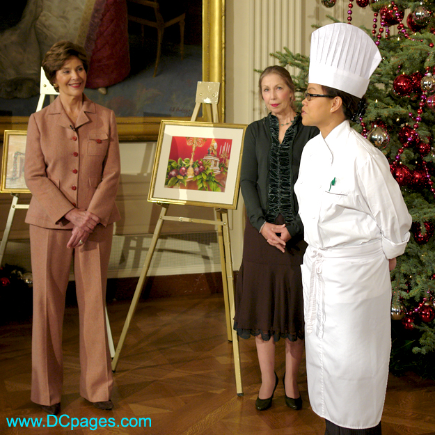 Mrs. Laura Bush and White House Chef Cris Comerford explain the holiday reception menu in the State Dining Room.