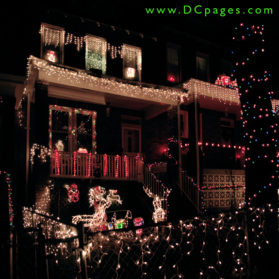 Strands of icicles, candy canes, window displays, reindeer, and white lights brighten up this home.