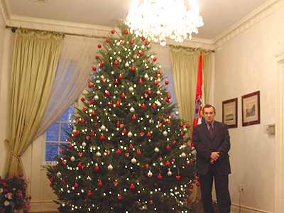One of the Croatian Embassys' Aid beside the Christmas tree
