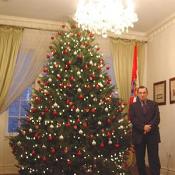 One of the Croatian Embassys' Aid beside the Christmas tree