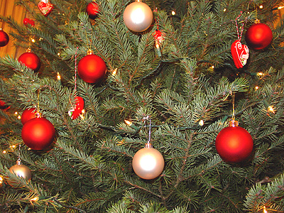 A close up of the ornaments displayed on of the Christmas trees