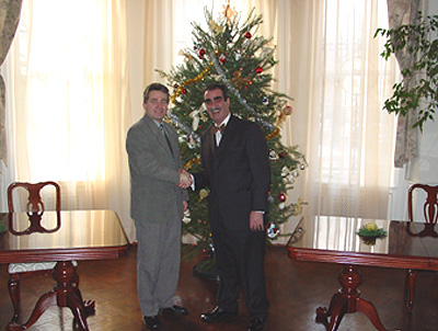Two Bulgarian Ambassadors' Aids stand infront of the Christmas tree