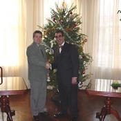 Two Bulgarian Ambassadors' Aids stand infront of the Christmas tree