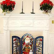 The gorgeous fireplace covered in Christmas decorations