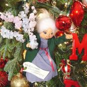 The old woman from Tikki Tikki Tembo hangs from the Christmas tree.
