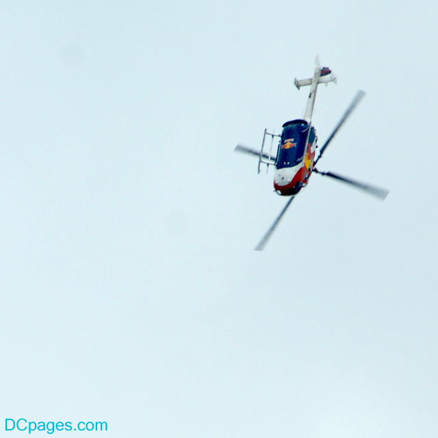 "Please have air-sickness bag ready for this next move ..." Red Bull Bo.-105 Stunt Helicoptor