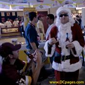 A Redskin fan pleads for an early gift from Santa. Saint Nic gives the fans some Holiday Cheer. "Ho Ho Ho. Dan Snyder has got quite a show going on! Redskins win this one. Thumbs up to good beer and great seats."