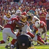 99-Andre Carter fights his way through Cardinals offensive line.