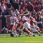 Anquan Boldin (81) is tackled by Redskins defenders for no gain. 