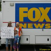 Family Posing in front of FOX NEWS truck.