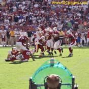 Clinton Portis (26) is about to get embraced by Linebacker Monty Beisel 