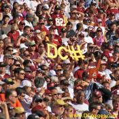 Redskin fan holds up a DC Fence (defense) sign to motivate the team.