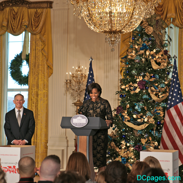 First Lady next to White House Christmas tree