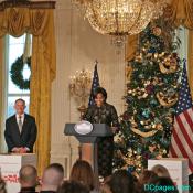 First Lady next to White House Christmas tree