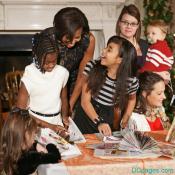 Mrs. Obama helps to make a recycled Christmas Tree in the White House