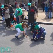 DC Saint Patricks Day Parade - Children have fun picking up candy tossed to them. 