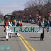St Patricks day parade - L.A.O.H, Division 9 from Rockville, Maryland march down Constitution Avenue. The Orange and Green 'Old Town Trolley' is in the background.