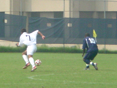 #7, Ricky Schramm of Georgetown, races to the ball in an effort to beat Howard's Famara Cham.