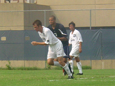 A Georgetown University player takes a running start for one of the many free kicks that were given during the game.