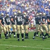 Steve Adair, #94, and the rest of the defensive line run off the field after stopping VMI from scoring.