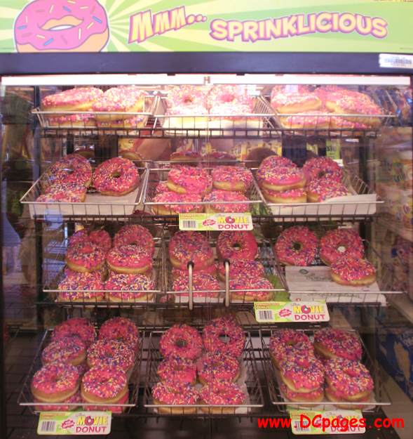 MMM... SPRINKLICIOUS - Racks of tasty doughnuts waiting to be eaten.