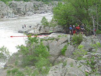 The arrow indicates the direction the kayakers will be coming from down the falls.