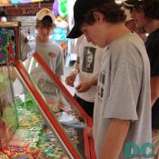 These young teenager boys try to figure out how to win money from the machine.