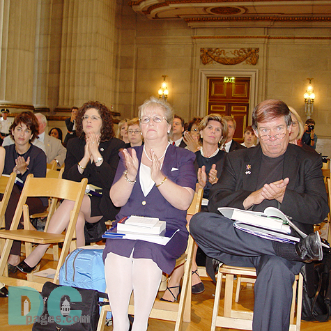 Families members of victims applaud the 9-11 Commission report.