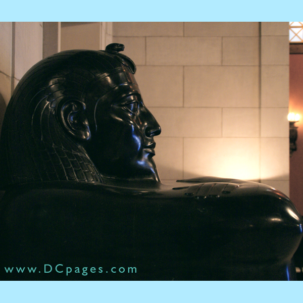 Side view of the Egyptian style statue at the foot of the Grand Staircase.