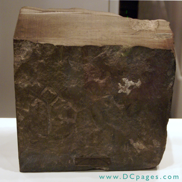 Americanism Museum - This stone was found when restoring the White House. It was a gift of President Truman in 1950 to the Scottish Rite. Notice the marking of a Mason Compass. Square, compass, and handle was the personal mark of this stone stone mason.