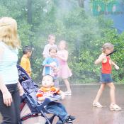 Kids were getting wet under the mist shower!