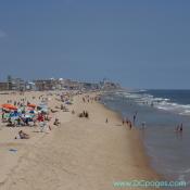 Ocean City - Coastline image from 50th street of vacationer's setting up for the day at 11:00am.