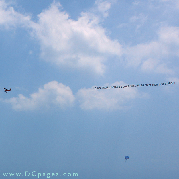 Ocean City - Airplane banners and vacationers parasailing can be seen frequently while relaxing on the beach.