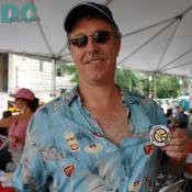 A man proudly displays his 'Make Levees Not War' button