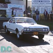 1966 Oldsmobile Cutlass opting to not use the burn-out pit. Could be running a 400 like the one in the 4-4-2, but it might be a 330 Rocket or even a 425. Notice the vintage Maryland tag.