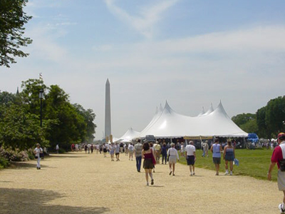 A view of the Washington Monument beyond the crowded tents of the festival