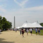 A view of the Washington Monument beyond the crowded tents of the festival