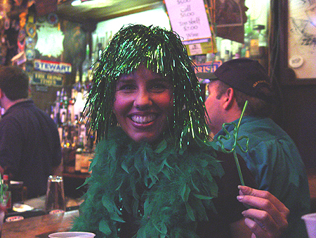 A green tinsel girl enjoys the party inside Kelly's Irish Times. "Can I get a picture with my other friends?"
