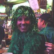 A green tinsel girl enjoys the party inside Kelly's Irish Times. "Can I get a picture with my other friends?"