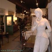 Onslow Square Antiques - A peak into the front of the store, lends a view of what is to come. Marble and bronze statuary, banquet tables for the more formal dining rooms. Rich dark woods that speak of elegance.