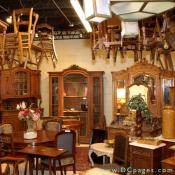 Chelsea and Co. Antiques - Armores, bookcases, chairs hanging everywhere. The blue chairs are a set of 8 Louis Philippe dining chairs.