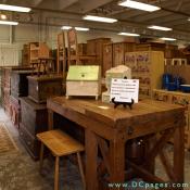 Great British Pine Mine - The front of the Pine Mine features a workbench from the Royal Doulton factory in Staffordshire, England, and a row of nineteenth century trunks from Europe in original decorative paint.