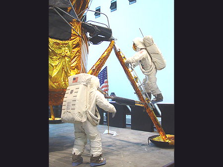 Full scale Lunar atronauts climbing out of the Lunar Landing Module.