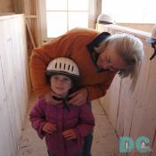 Mary Markoff - prepares a young rider (her grand-daughter) for a horse ride.