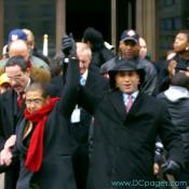 Congresswoman Eleanor Holmes Norton and Mayor Adrian M. Fenty raise their arms in solidarity.