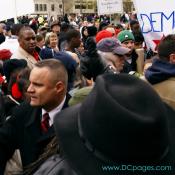 Mayor Adrian M. Fenty looks out a crowd of demonstators ready to begin the DC Voting Rights March.