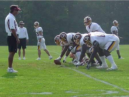 Redskins offense starting of with passing drills.